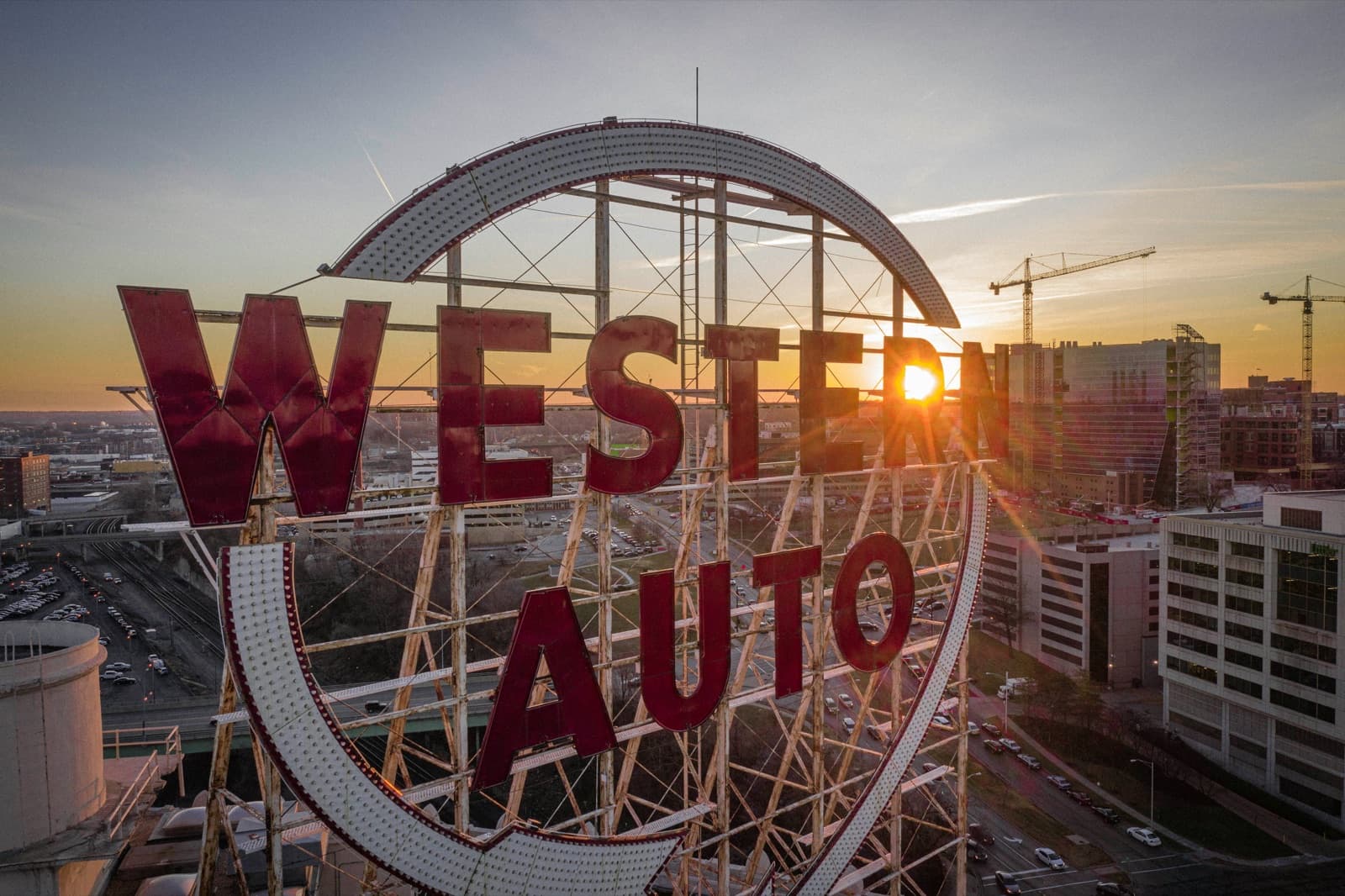 Western Auto sign above the Kansas City skyline at sunset