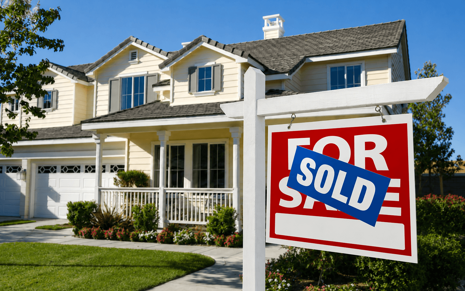 For sale and sold sign in front of a Kansas City home