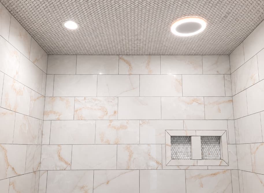 Detailed tiled shower ceiling with recessed lighting